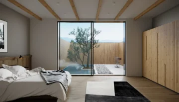 Zen-inspired bedroom featuring sliding glass doors overlooking private garden with reflecting pool