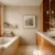 Warm minimalist bathroom featuring natural wood vanity, marble countertops, built-in bathtub, and large window with natural light